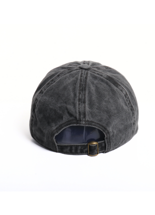 Black denim cap with a gold buckle on a white background