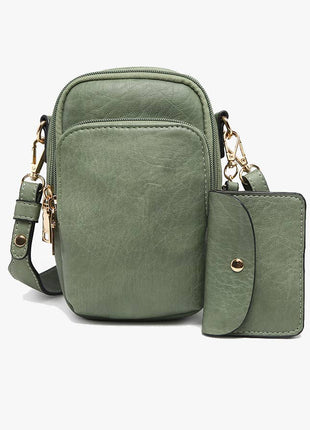 Green crossbody bag with matching wallet on a white background