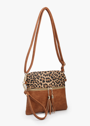 Brown handbag with leopard print section on a white background