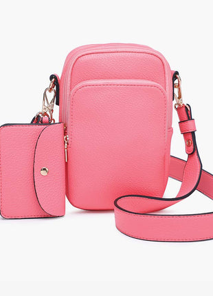 Pink crossbody bag with matching wallet on a white background