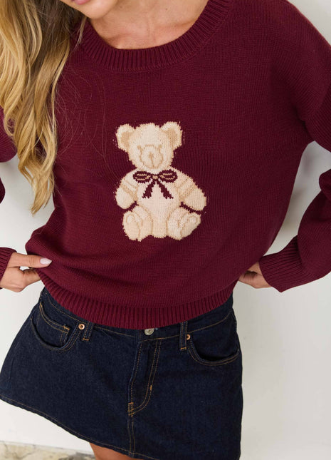 Burgundy pullover with a teddy bear