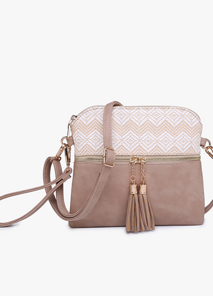 Beige handbag with white patterned top section on a white background