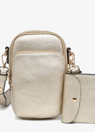Gold crossbody bag with matching wallet on a white background