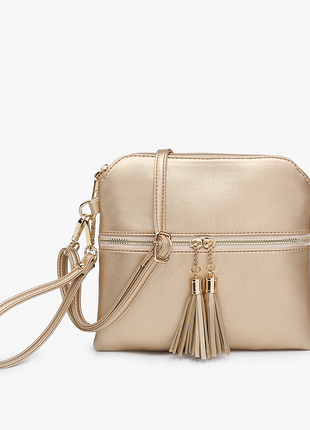 Gold handbag with tassels on a white background