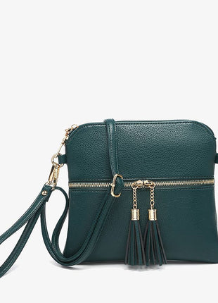 Green handbag with gold accents on a white background