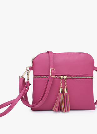 Pink handbag with gold accents on a white background