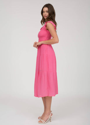 Woman wearing a pink dress on a white background
