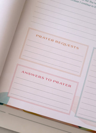 Open book with sections titled 'Prayer Requests' and 'Answers to Prayer'.