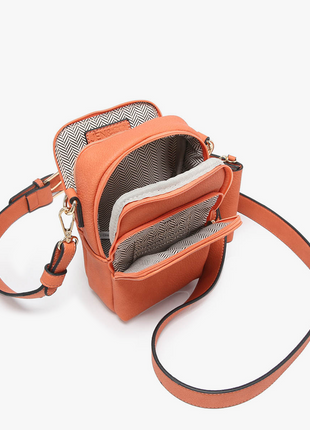 Orange crossbody bag with a strap on a white background
