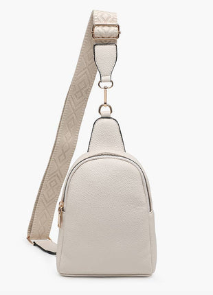 Light beige backpack with a matching strap on a white background