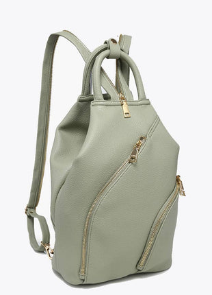 Light green backpack with gold zippers on a white background