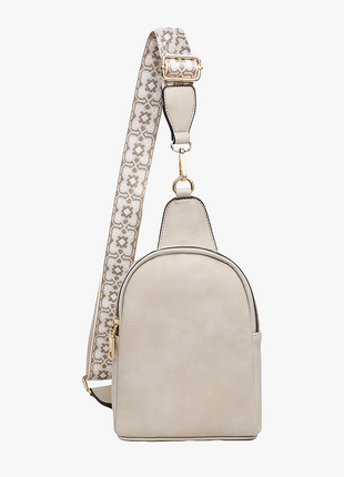 Light gray backpack with a decorative rhinestone strap on a white background