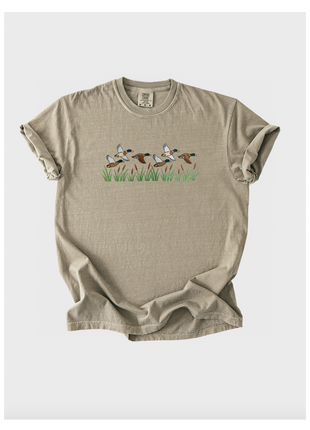Beige t-shirt with graphic design on a white background
