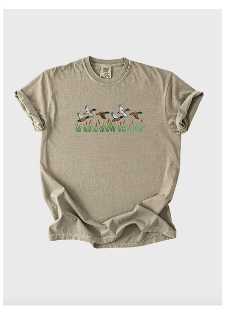 Beige t-shirt with graphic design on a white background
