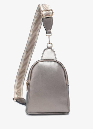 Metallic silver backpack with a strap on a white background