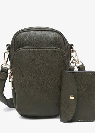 Green leather crossbody bag with matching pouch on a white background