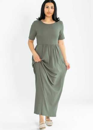 Woman wearing a green dress on a white background