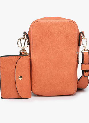 Orange crossbody bag with matching pouch on a white background