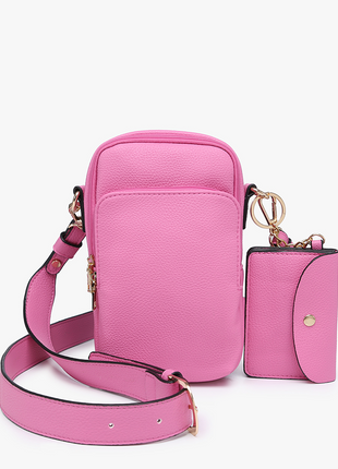 Pink crossbody bag with matching wallet on a white background