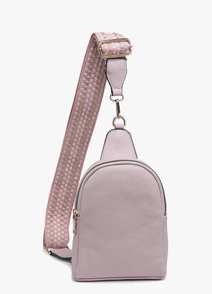 Pink backpack with a strap on a white background