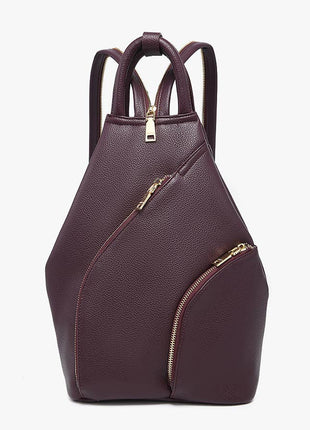 Purple backpack with gold zippers on a white background