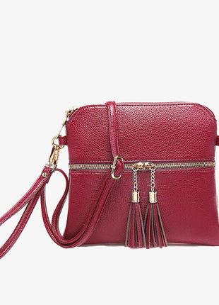 Red handbag with gold accents on a white background
