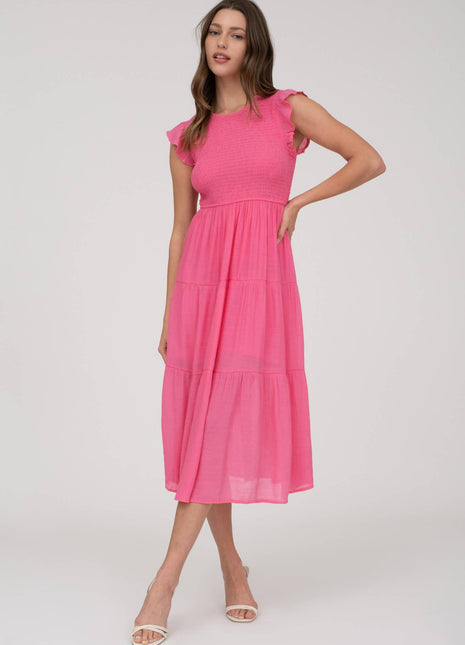 Woman wearing a pink dress on a white background