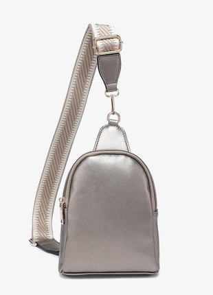 Metallic silver backpack with a strap on a white background