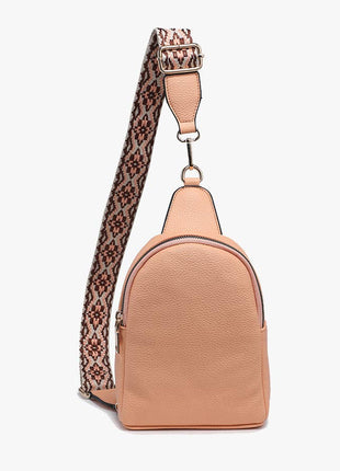 Tan backpack with a patterned strap on a white background