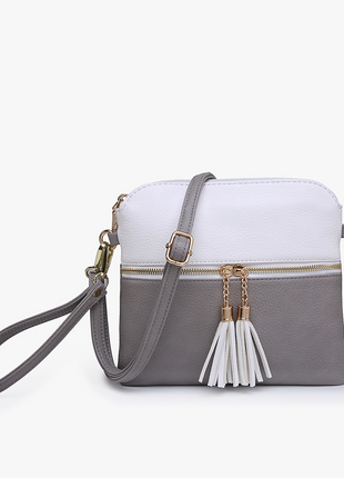 White and gray handbag with tassel on a white background