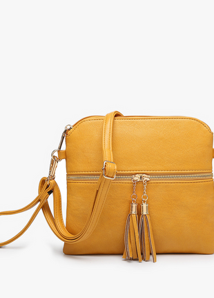 Yellow handbag with a strap and tassel on a white background