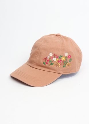 Brown cap with floral embroidery on a white background