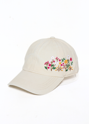 Beige cap with floral embroidery on a white background