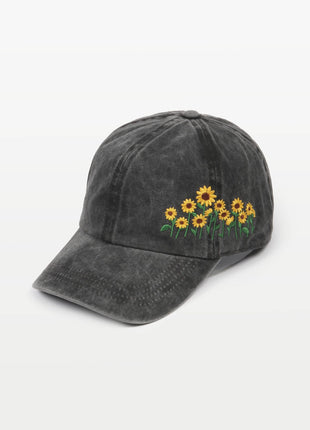Black cap with sunflower embroidery on a white background